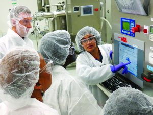 Photo 2: FDA students learn how to operate centrifuge controls for downstream operations. 