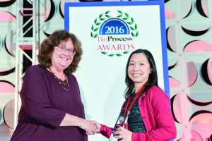 Cindy Jung accepts GlaxoSmithKline’s Corporate Citizenship award from BPI’s Anne Montgomery.