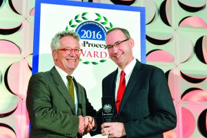 Mark Petrich (Merck’s director of component engineering) accepts BPI’s 2016 Industry Champion award from James Vogel (The BioProcess Institute’s founder).