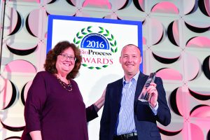 Simon Saxby (Stratophase) accepts the upstream technology award from BPI’s Anne Montgomery