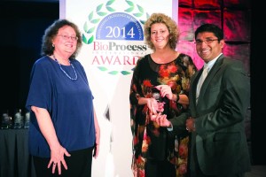 Satish Nadig and Ann-Marie Broome accepting for ToleRaM from BPI editor in chief, Anne Montgomery 